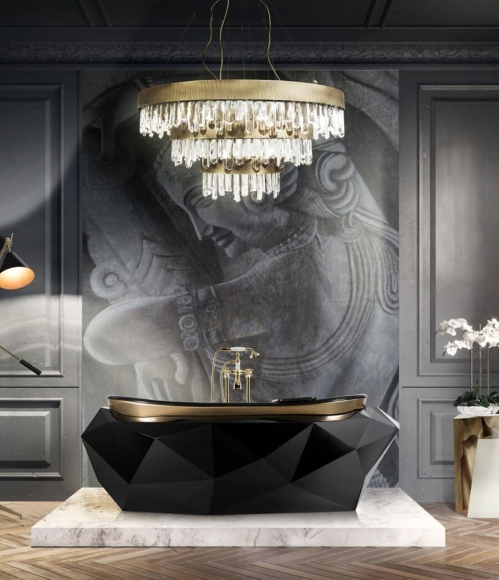 The large modern chandelier is just the right partner for the black bathtub design in this modern bathroom design.
